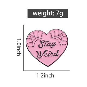 Pink heart enamel pin with spider web design and Stay Weird text, 1.2 x 1.0 inches