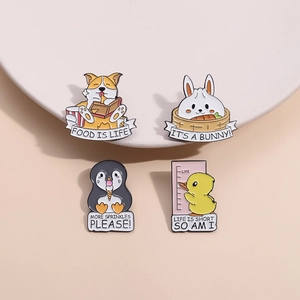 Set of four cartoon animal enamel pins including corgi and duck on a pink background