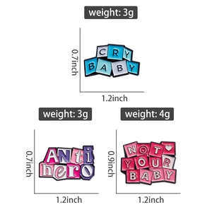 Detailed view of three enamel pins featuring motivational text and specific dimensions