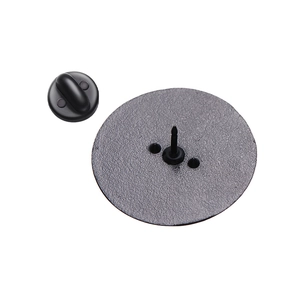 Detailed back view of a matte black alloy badge base with secure rubber pin backings