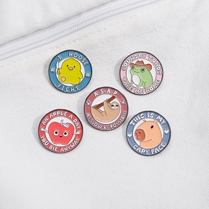 Cute set of round enamel lapel pins featuring capybara, frog and sloth on canvas background