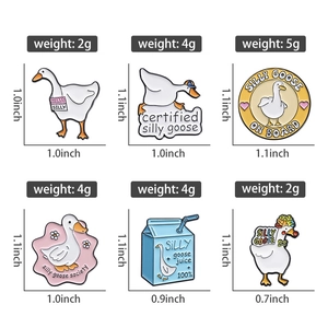Detail view of cartoon white goose enamel pins with dimensions and weight measurements