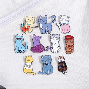 Set of 10 colorful cartoon cat enamel pins featuring 1989 and Junior Jewels designs