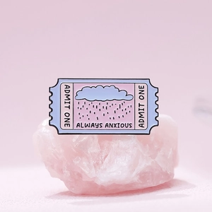 Creative movie ticket enamel pin in pastel purple with rain cloud and emotional quote