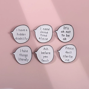 Set of six white speech bubble enamel pins with mental health text on pink background