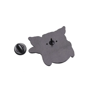 Rear view of enamel pin showing metal texture and black rubber clutch backing accessory