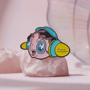 Cute cartoon character enamel pin with headphones on pink crystal stone backdrop