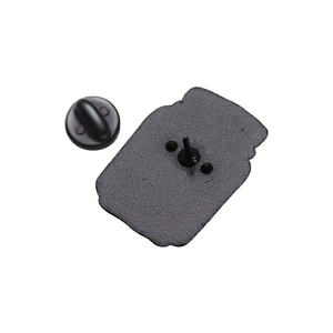 Detail of the black matte metal brooch pin back and rubber clutch fastener replacement