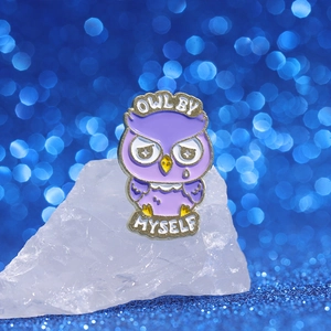 Cartoon purple owl enamel pin with Owl By Myself text on a white crystal stone