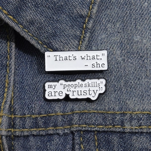 Funny geometric speech bubble enamel pins with inspirational quotes on denim jacket