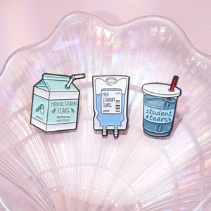 Three-piece medical student tears enamel pin set featuring milk carton and IV bag designs