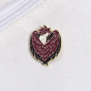 Anime enamel pin of Howl and Sophie with wings on white canvas background
