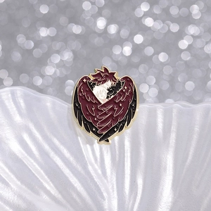 Exquisite angel and demon enamel pin with red and black wings for fantasy fans
