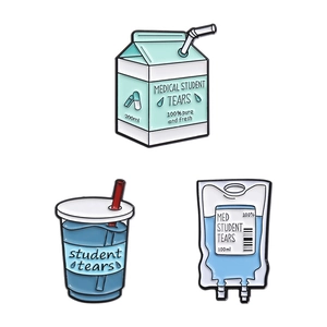 Set of three medical student themed enamel pins featuring milk carton and infusion bag