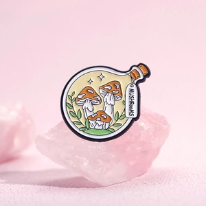 Creative mushroom bottle enamel pin with forest theme on pink crystal background