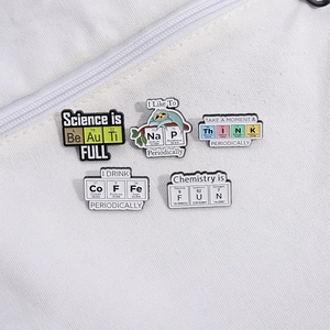 Five chemistry science enamel pins featuring periodic table symbols on canvas background