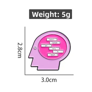 Detail of pink enamel badge showing Don't Grow Up It's A Trap slogan and dimensions