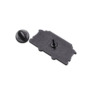 Back view of black enamel trolley brooch pin with metal needle and rubber clutch