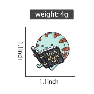 Detail showing a 4g cookie character enamel pin reading Dark Magic 101 book
