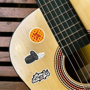 Waterproof vinyl math stickers with formulas and puns applied on a wooden guitar body