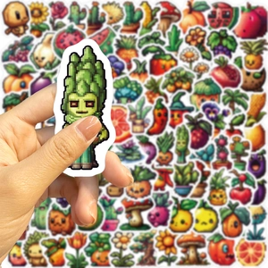 Detail of pixel art fruit stickers being held showing waterproof material and matte finish