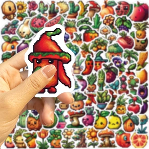 Close-up of 8-bit pixel art fruit and plant stickers being held for size scale