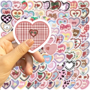 Close-up of small heart-shaped doodle stickers for DIY scrapbooking and notebook decor