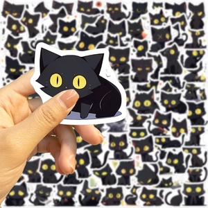 Close-up of waterproof black cat stickers for decorating laptops and guitars