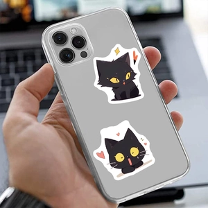 Close-up of clear phone case featuring cute black cat graffiti with yellow eyes and hearts