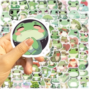 Close-up of waterproof cartoon frog stickers showing vibrant green print and precision cut