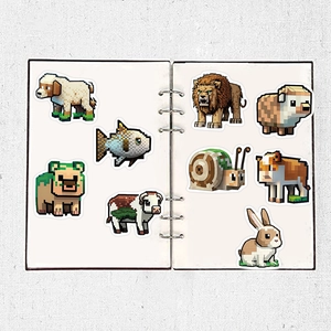 Detail of pixel art animal stickers applied to a white spiral notebook on a grey background