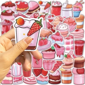 Dettaglio di adesivi rosa con dolci per decorazione fai-da-te di laptop e scrapbooking