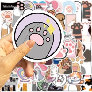 Close-up of a waterproof cartoon cat paw sticker featuring a purple glitter effect