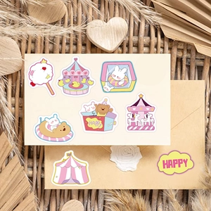 Close-up of cute amusement park stickers with rabbits and circus motifs on beige envelope