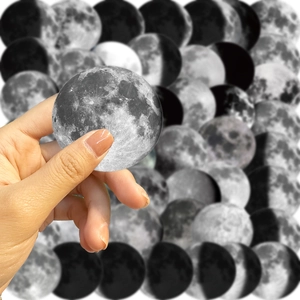 Close-up of matte moon phase stickers showing realistic lunar texture and crater details