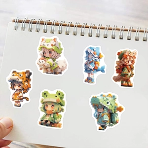 Detail of pixel art girl stickers in animal hoodies on a notebook page for DIY decoration