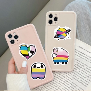 Detail of pink and beige iPhone cases with rainbow heart and cartoon stickers