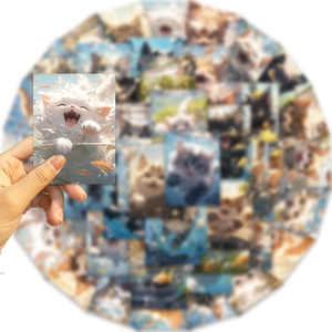 Close-up of a smiling white cat sticker held in hand with background stickers