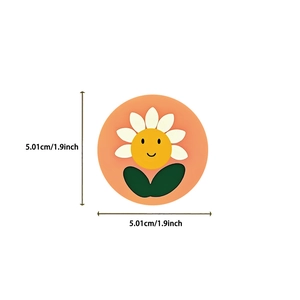Close-up of a 5.01cm smiling sunflower sticker for decorating guitars and laptops