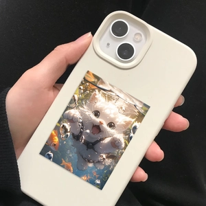 Close-up of creamy white silicone phone case featuring cute cat underwater illustration
