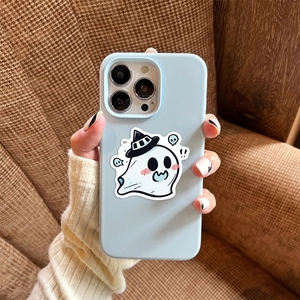 Close-up of matte blue phone case with cute white ghost cartoon on a textured background
