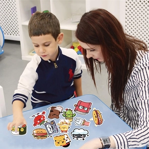 Kids and teacher playing with cute waterproof cartoon food and lifestyle stickers