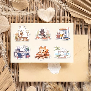 Detailed close-up of six animal doodles stickers on cream card with dried flowers background