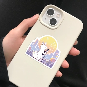Detail of cartoon fox playing guitar sticker on white smartphone case held by hand