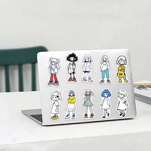 Close-up of colorful cartoon girl stickers applied on a silver laptop for DIY decoration