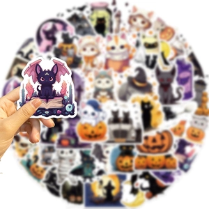 Handheld Halloween cartoon cat stickers featuring witch cats and pumpkins for DIY decor