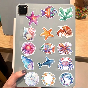 Detailed view of colorful marine animal stickers on a tablet for DIY decoration