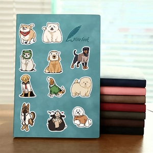 Close-up of cute cartoon dog stickers on a blue notebook with various dog breeds