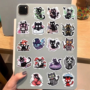 Detail of waterproof cartoon black cat stickers applied on a grey tablet casing