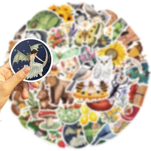 Close-up of vintage fairy and forest animal stickers for scrapbooking and gifts